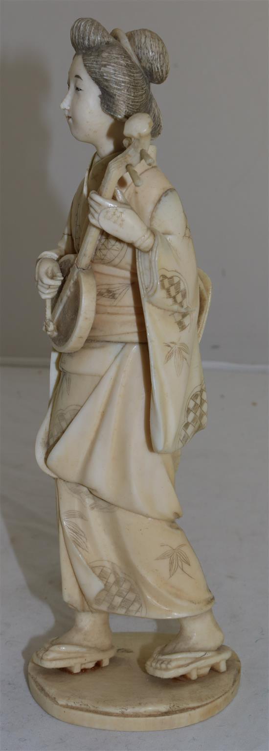 A Japanese sectional ivory figure of a bijin, early 20th century, 26.5cm